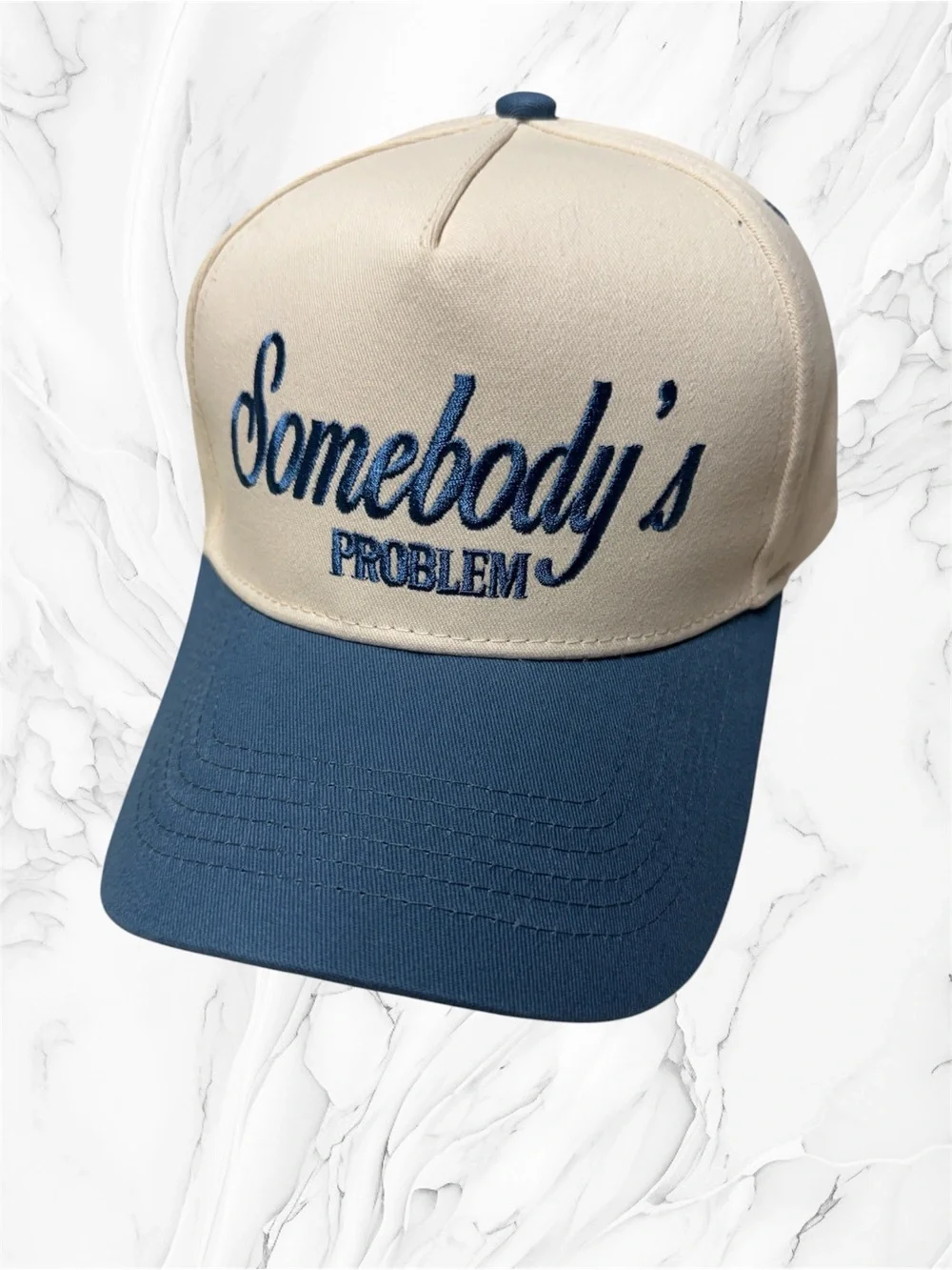 Somebody’s problem Two-Tone Cream and Blue Trucker Cap unisex SnapBack